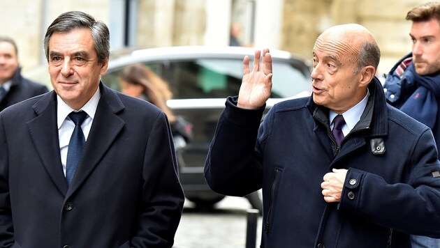 Alain Juppe (rechts) wurde als Alternativkandidat gehandelt, doch der Machtkampf ist vorerst vorbei. (Bild: AFP)