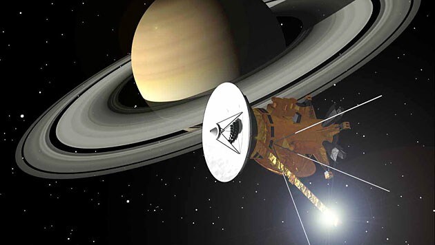Illustration: Die Sonde "Cassini" vor dem Ringplaneten Saturn (Bild: dapd (Archivbild))