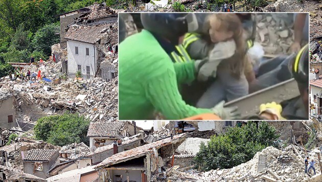 "Sie lebt!" Retter bergen in Pescara del Tronto die kleine Giorgia aus den Trümmern. (Bild: AP)