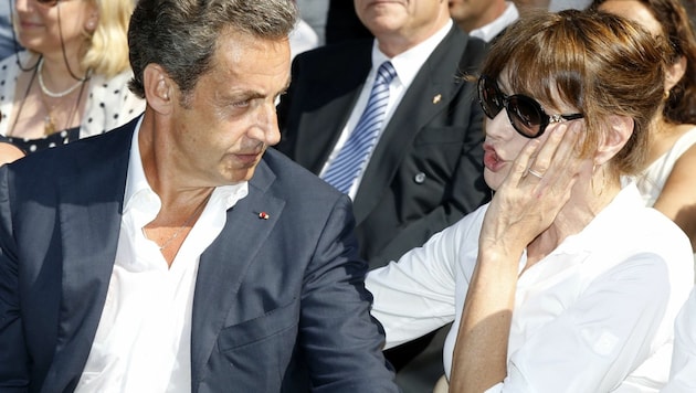 Nicolas Sarkozy und seine Frau Carla Bruni (Bild: AFP)