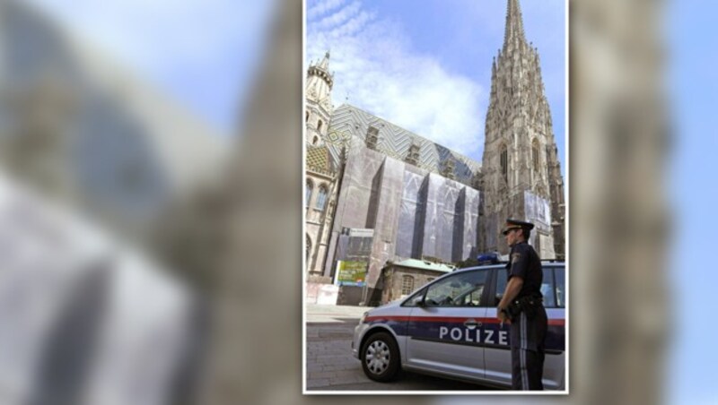 Ein Polizist vor dem Wiener Stephansdom (Bild: APA/ROLAND SCHLAGER)