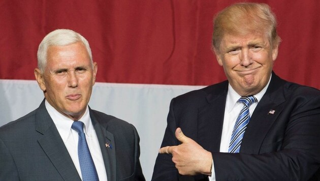 US-Präsidentschaftsbewerber Trumpjolt Indiana-Gouverneur Mike Pence (li.) mit ins Boot. (Bild: AFP)