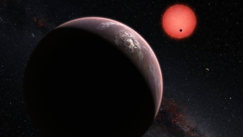 Künstlerische Darstellung: Der Zwergstern TRAPPIST-1 und drei seiner Planeten (Bild: ESO/M. Kornmesser/N. Risinger (skysurvey.org))