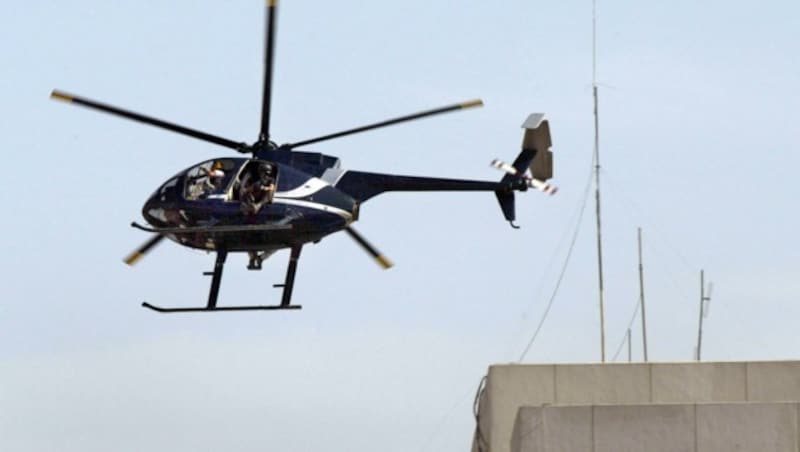 Ein Helikopter der Firma Blackwater im Irak (2005) (Bild: ALI YUSSEF/AFP/picturedesk.com)