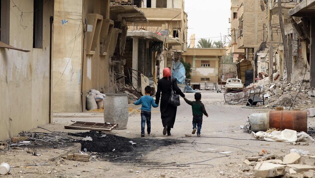 Rückkehr in die vom IS gepeinigte Oasenstadt Palmyra (Bild: APA/AFP/LOUAI BESHARA)