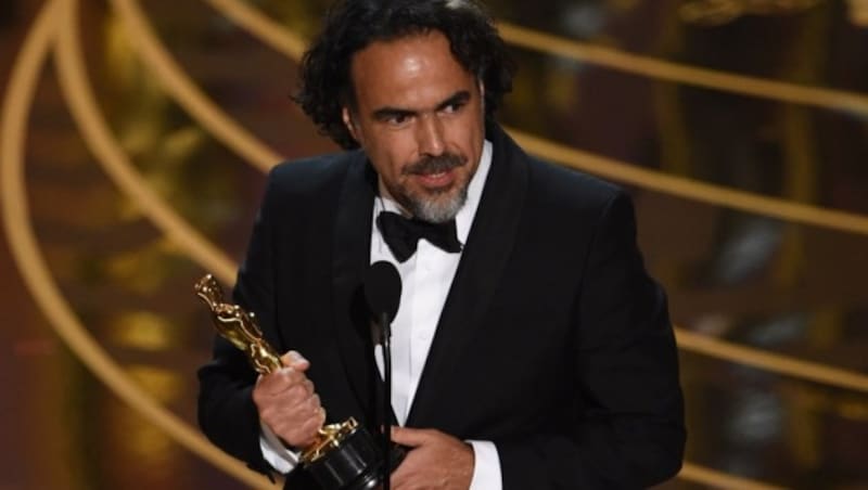 Alejandro Gonzalez Inarritu wird für die beste Regie ausgezeichnet. (Bild: APA/AFP/MARK RALSTON)