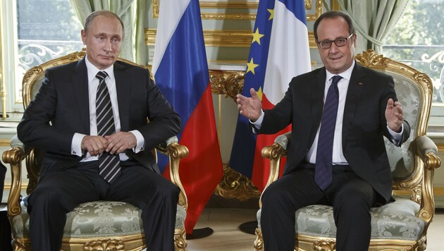 Russland und Frankreich kooperieren nun enger: die Präsidenten Putin und Hollande (Bild: AP)