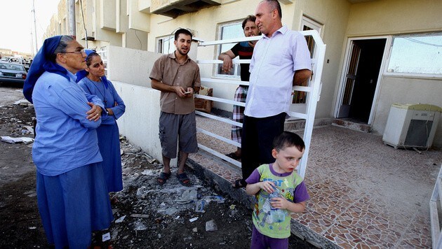 Aus Mossul geflohene Christen im Irak (Bild: AP)