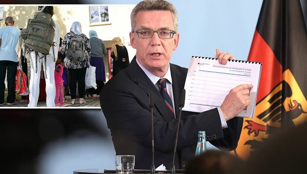 Der deutsche Innenminister Thomas de Maiziere rechnet mit 800.000 Asylwerbern im Jahr 2015. (Bild: APA/EPA/RAINER JENSEN, APA/MARTIN WICHMANN)
