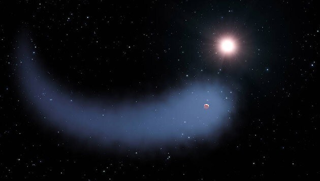 Der Exoplanet GJ 436b und sein gewaltiger Wasserdampf-Schweif (Bild: NASA, ESA und G. Bacon (STScI))