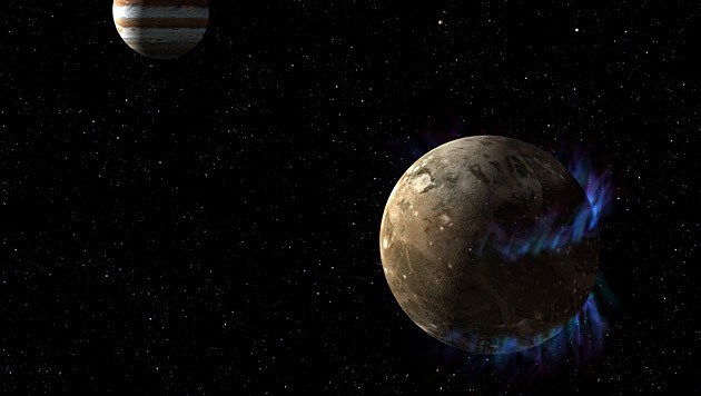 Künstlerische Darstellung von Ganymed samt Polarlichtern (Bild: NASA/ESA/G. Bacon)