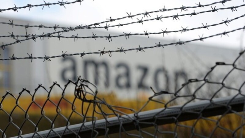 Der US-Onlinehändler Amazon ist für kompromisslose Effizienz und erdrückende Arbeitslast bekannt. (Bild: EPA)