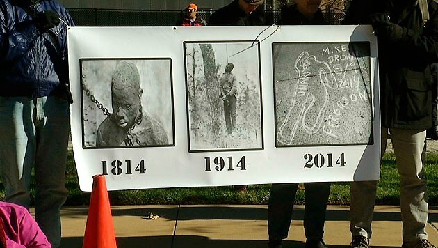 Demonstranten mit trauriger Botschaft: Seit 200 Jahren hat sich nicht viel verändert. (Bild: AP)
