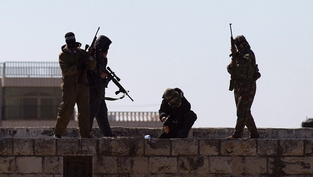 A Hamász harcosai (Bild: APA/EPA/ATEF SAFADI)