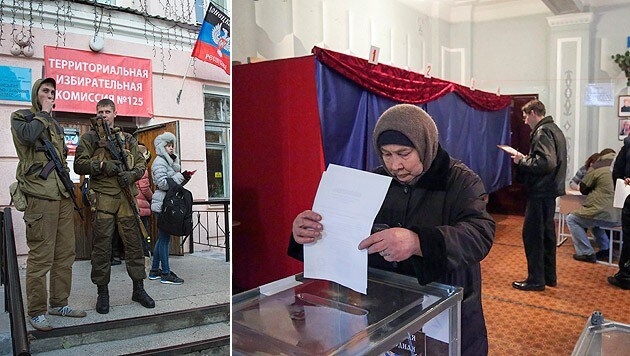 Donezk: Vor den Wahllokalen stehen bewaffnete Rebellen. (Bild: AP)