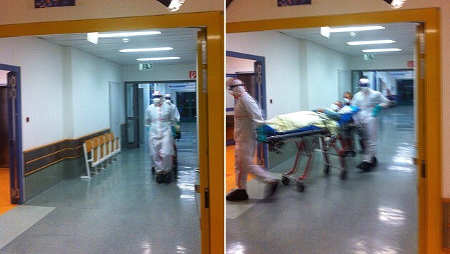 Der mutmaßlich mit Ebola infizierte Patient wird in den Behandlungsraum geschoben. (Bild: "Krone")