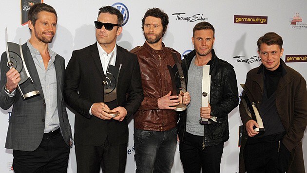 Robbie Williams ist wieder dabei, Jason Orange (ganz links) steigt bei Take That aus. (Bild: JOERG CARSTENSEN/EPA/picturedesk.com)