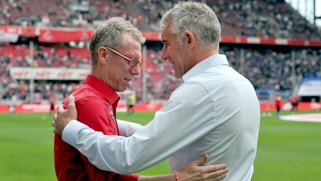 Willkommen in der Bundesliga! HSV-Coach Slomka begrüßt Köln-Trainer Stöger. (Bild: APA/EPA/Matthias Balk)